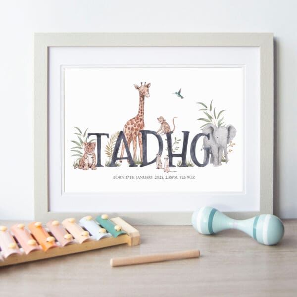 framed print of Name Tadhg surrounded by illustrated giraffe, elephant, tiger, meerkat and monkey