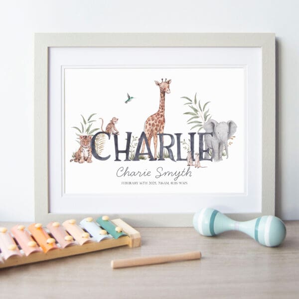 framed print of Name Charlie surrounded by illustrated giraffe, elephant, tiger, meerkat and monkey