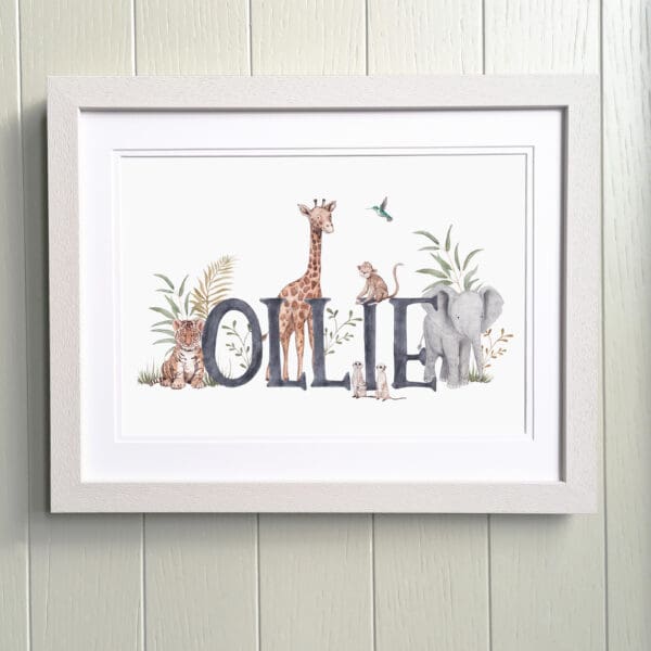 framed print of Name Ollie surrounded by illustrated giraffe, elephant, tiger, meerkat and monkey